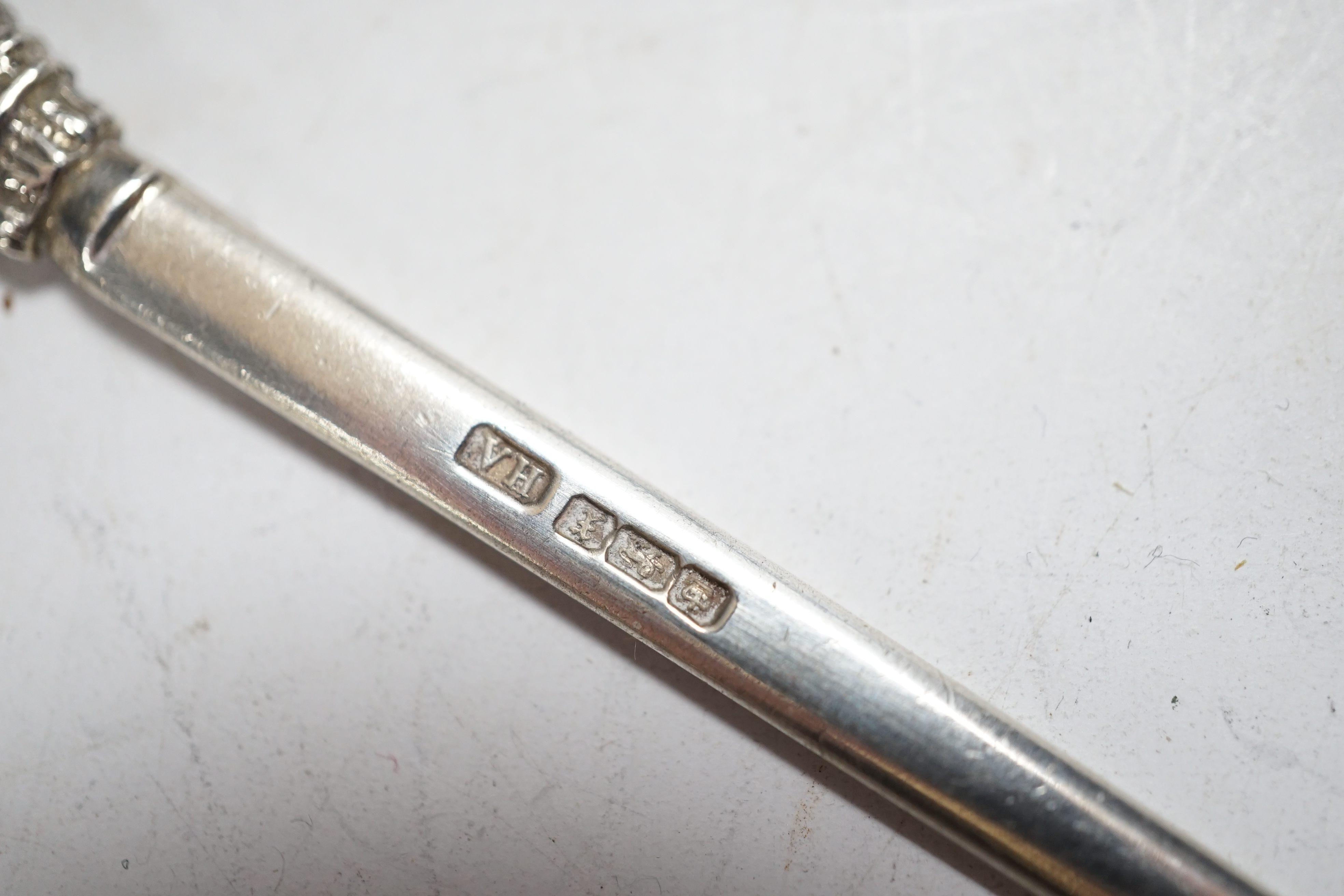 A pair of George V silver game skewers, with Prince of Wales feathers terminals, Atkin Brothers, Sheffield, 1915, 10.1cm, a Hanau? white metal miniature model of a goat pulling a cart and a Dutch white metal miniature mo